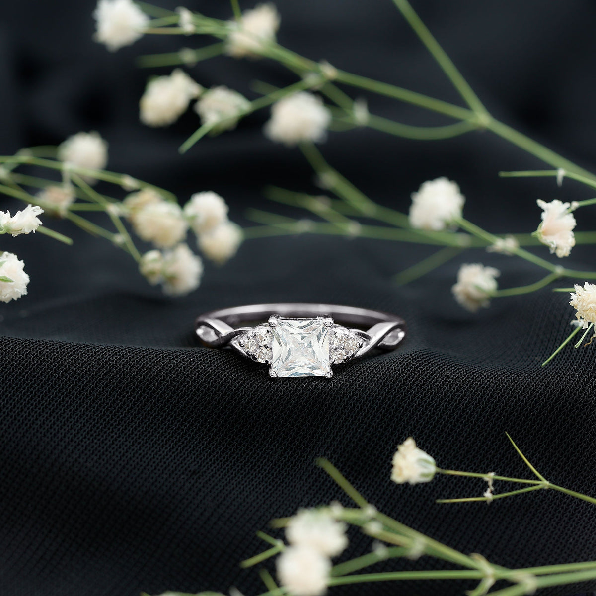 Rosec Jewels 1.25 CT princess cut cubic zirconia crossover engagement ring with sparkling stones and intricate band design.