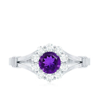 Amethyst and diamond halo split shank ring from Rosec Jewels, showcasing a large purple gemstone surrounded by sparkling diamonds.