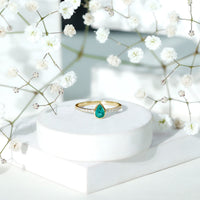 Pear Shaped Emerald Engagement Ring with Diamond Side Stones