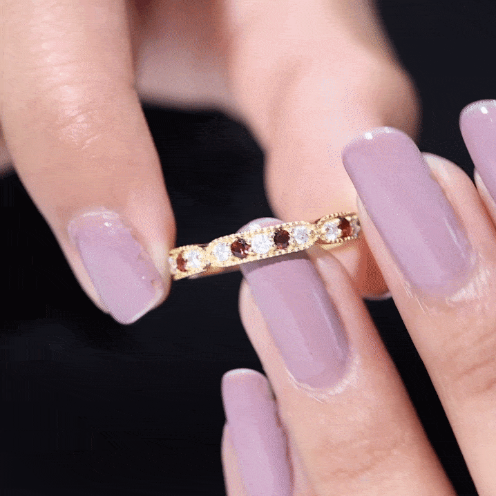 Vintage-inspired garnet eternity ring with diamonds from Rosec Jewels, featuring a yellow gold band and intricate design.