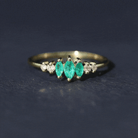 Marquise emerald and diamond 3-stone anniversary ring for women by Rosec Jewels, featuring a yellow gold band and elegant gemstone setting.