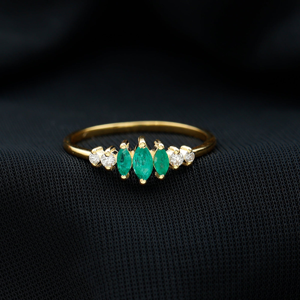 Marquise emerald and diamond three-stone anniversary ring for women by Rosec Jewels, featuring sparkling gemstones on a elegant band.