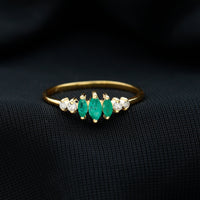Marquise emerald and diamond three-stone anniversary ring for women by Rosec Jewels, featuring sparkling gemstones on a elegant band.