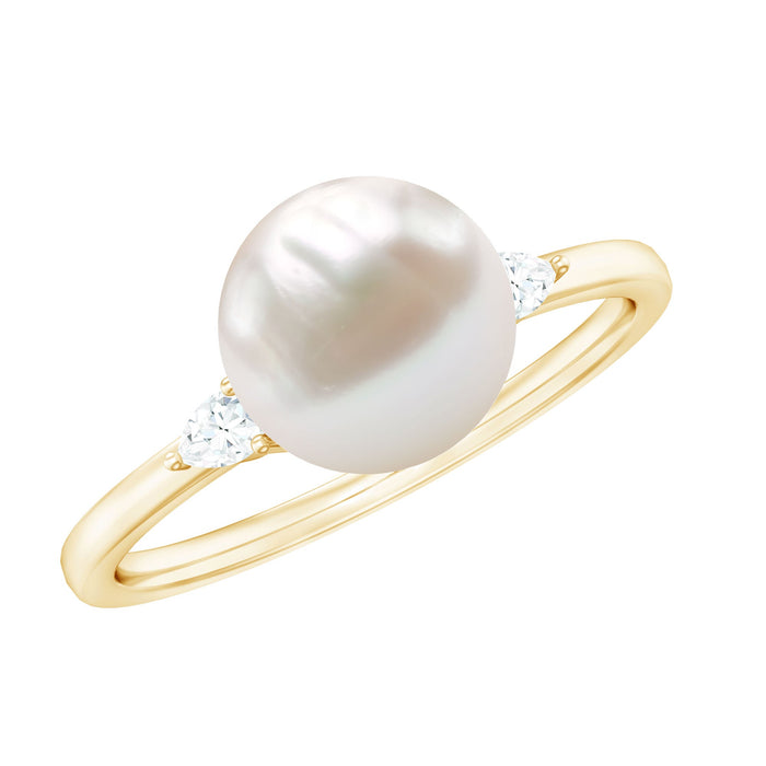 Freshwater pearl solitaire engagement ring with diamond accent from Rosec Jewels, featuring a 7.48-carat pearl on a sleek ring band.