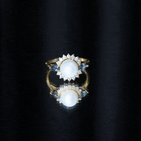 Elegant 8mm freshwater cultured pearl engagement ring with blue topaz by Rosec Jewels, featuring a gold band and intricate design.