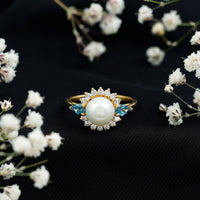 Elegant 8mm freshwater cultured pearl engagement ring with blue topaz accent, crafted by Rosec Jewels.