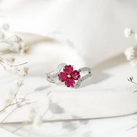Real ruby flower engagement ring with diamond split shank by Rosec Jewels, featuring a vibrant ruby flower centerpiece and sparkling diamonds.