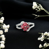 Real ruby flower engagement ring with diamond split shank, featuring a vibrant ruby centerpiece and sparkling diamonds, Rosec Jewels.