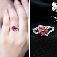 Real ruby flower engagement ring with diamond split shank by Rosec Jewels, showcasing a detailed ruby flower and sparkling diamond accents.