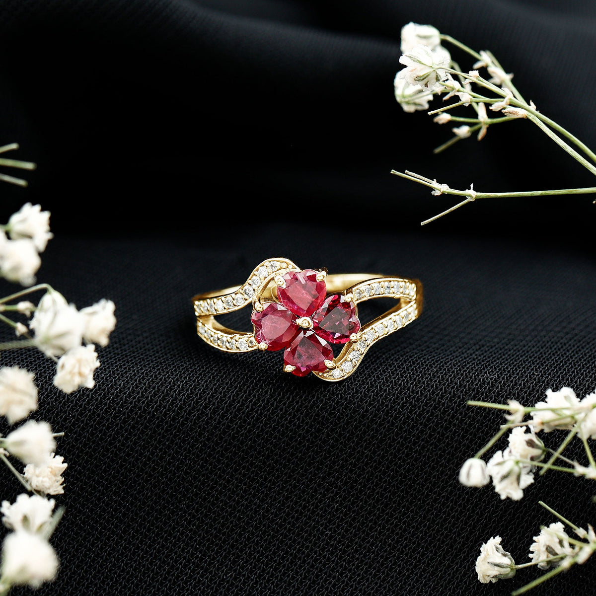 Real ruby flower engagement ring with diamond split shank by Rosec Jewels, featuring a vibrant ruby flower centerpiece and sparkling diamonds.
