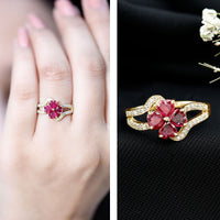 Real ruby flower engagement ring with diamond split shank by Rosec Jewels, featuring a central ruby flower and sparkling diamonds.