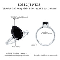 4.8 Carat Lab Grown Black Diamond Pear Shaped Engagement Ring With Surprise White Diamond