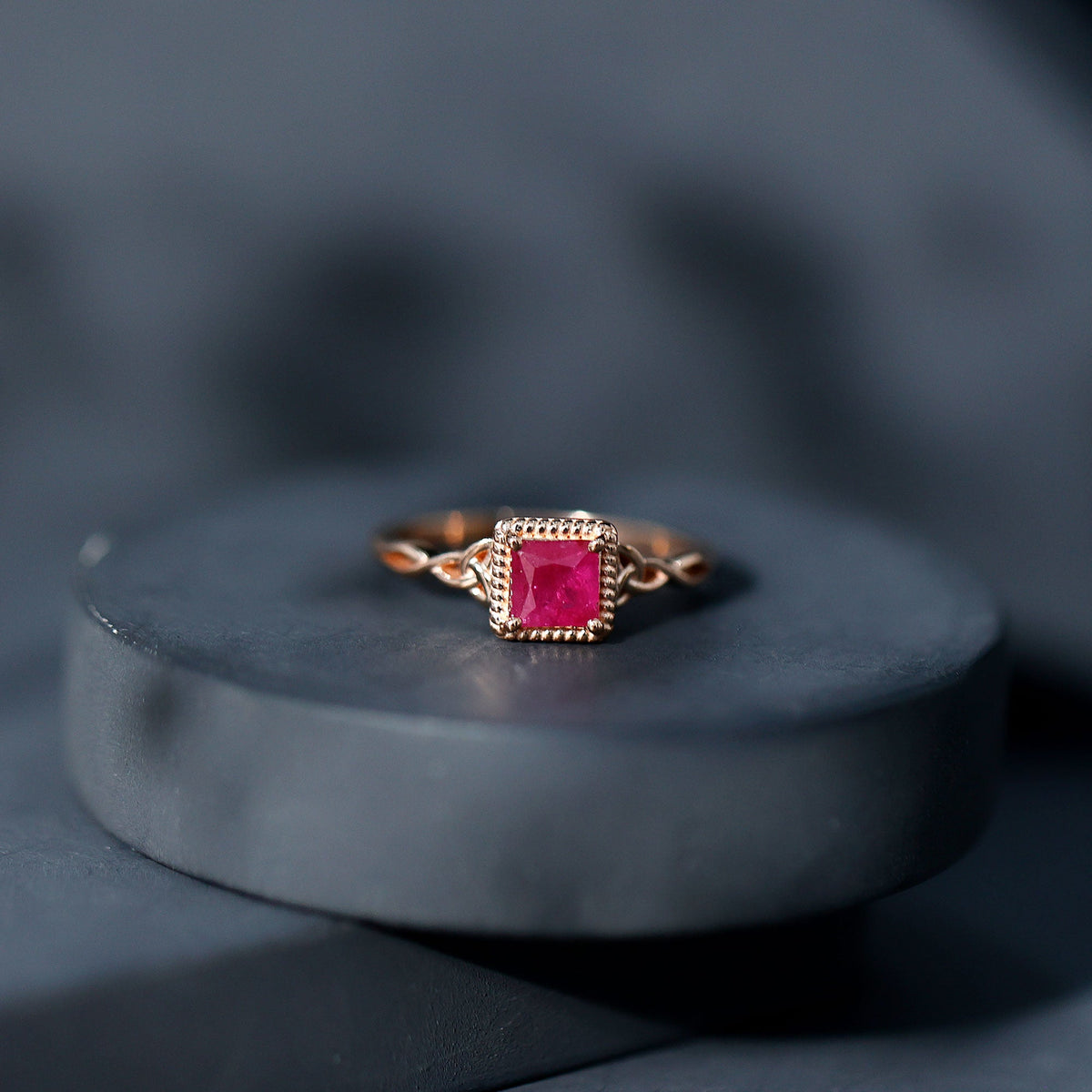 Natural 0.8 Carat princess cut ruby promise ring with Celtic knot design by Rosec Jewels, featuring a stunning gemstone setting.