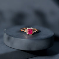 Natural 0.8 Carat princess cut ruby promise ring with Celtic knot design by Rosec Jewels, featuring a stunning gemstone setting.