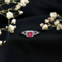 Natural 0.8 carat princess cut ruby promise ring with Celtic knot design from Rosec Jewels, featuring a silver band and intricate details.