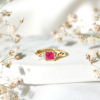 Natural 0.8 carat princess cut ruby promise ring with Celtic knot design from Rosec Jewels, featuring a detailed gold band.