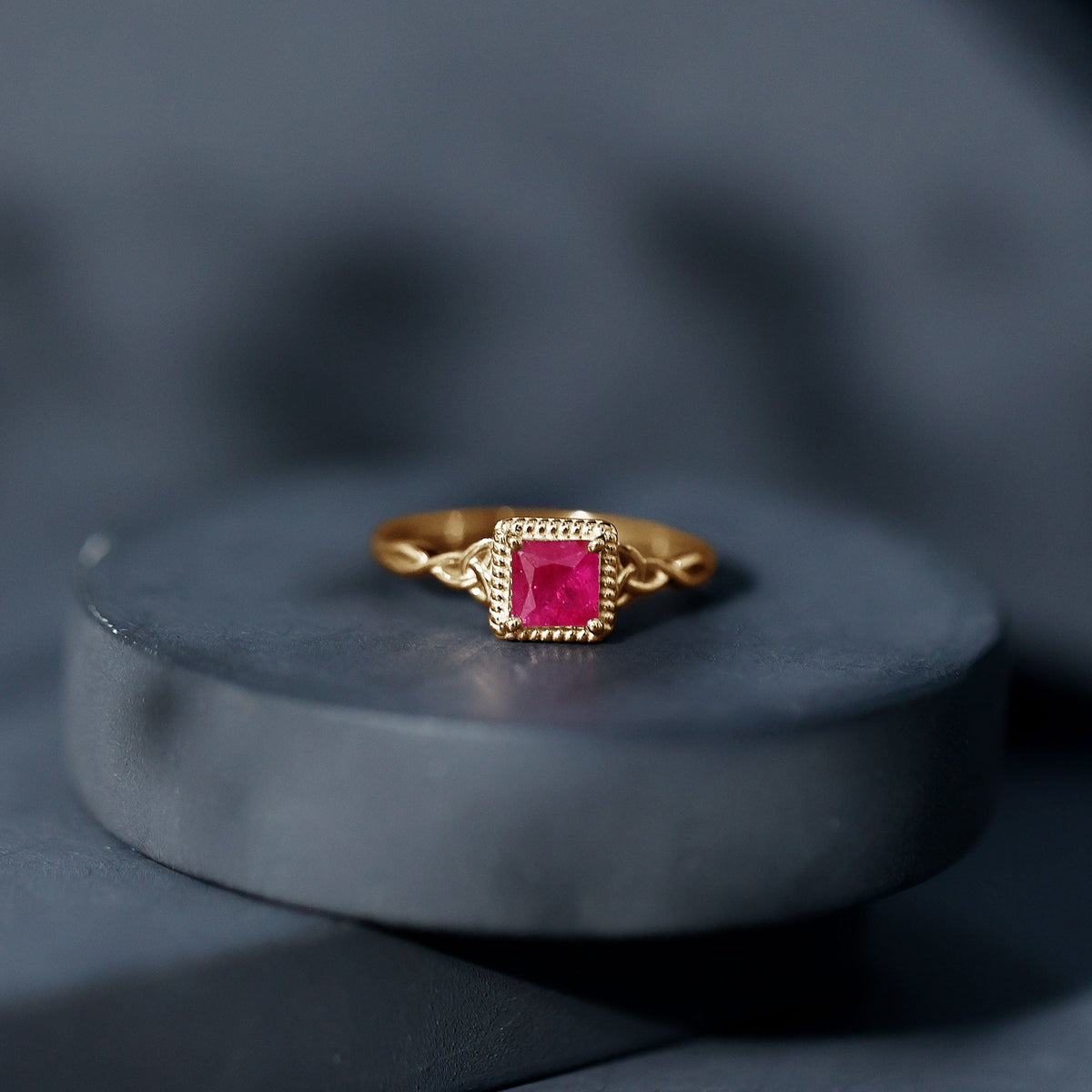 Natural 0.8 carat princess cut ruby promise ring with Celtic knot design by Rosec Jewels, showcasing a detailed gold band.