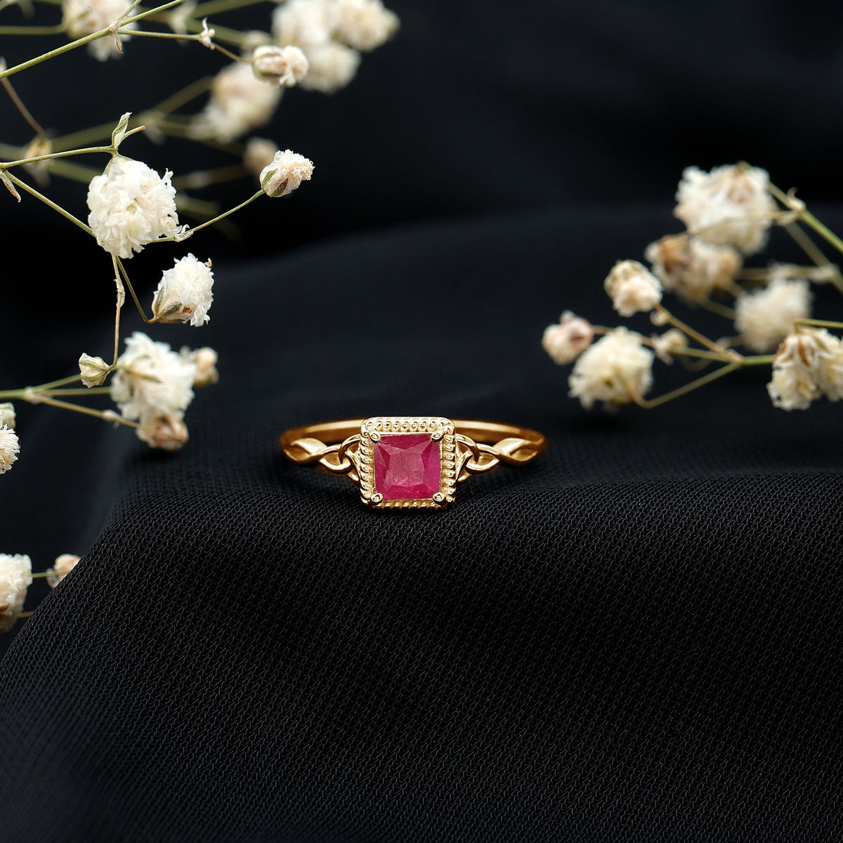 Natural 0.8 carat princess cut ruby promise ring with Celtic knot design, crafted by Rosec Jewels.