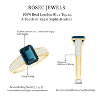 Rosec Jewels engagement ring featuring a 6x8mm London Blue Topaz side stone with diamond accents, set in a elegant ring setting.