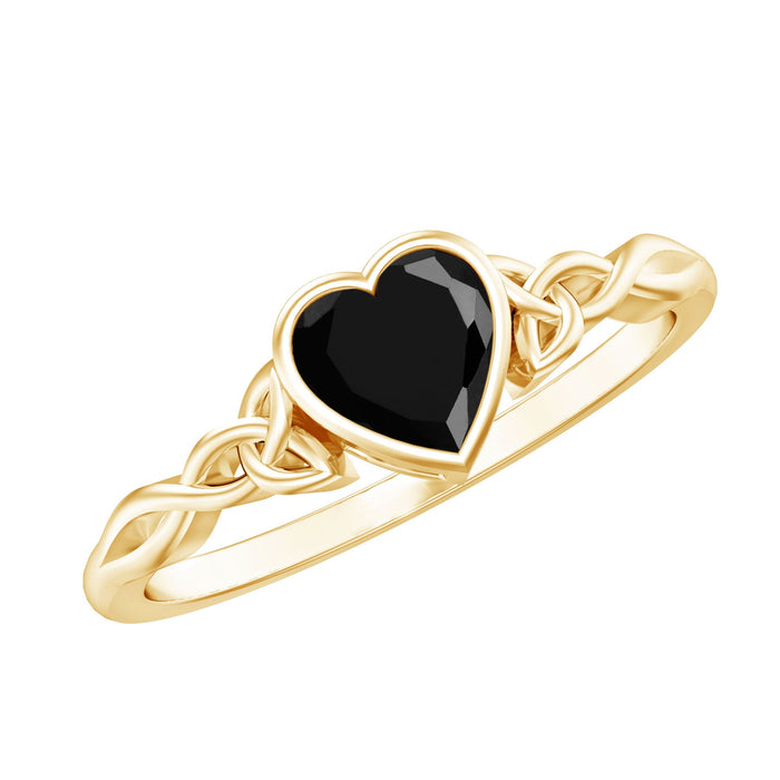 Lab-grown black diamond heart promise ring with Celtic knot design by Rosec Jewels, featuring a 0.6 carat gemstone and intricate band.