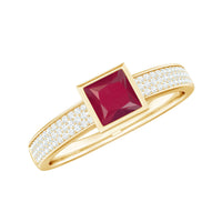 Natural 0.8 carat ruby princess cut engagement ring with diamond accents, featuring Rosec Jewels rings on a display.