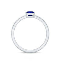 Rosec Jewels 5mm princess cut lab-created blue sapphire promise ring with small diamond accent, showcasing a silver band and elegant design.