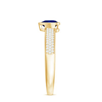 Blue sapphire heart-shaped solitaire engagement ring with pave diamond accents by Rosec Jewels, featuring a silver band and intricate detailing.