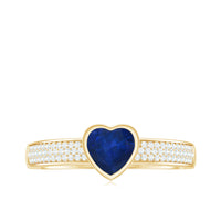 Blue sapphire heart solitaire engagement ring with pave diamonds by Rosec Jewels, showcasing a stunning blue gemstone and intricate diamond accents.