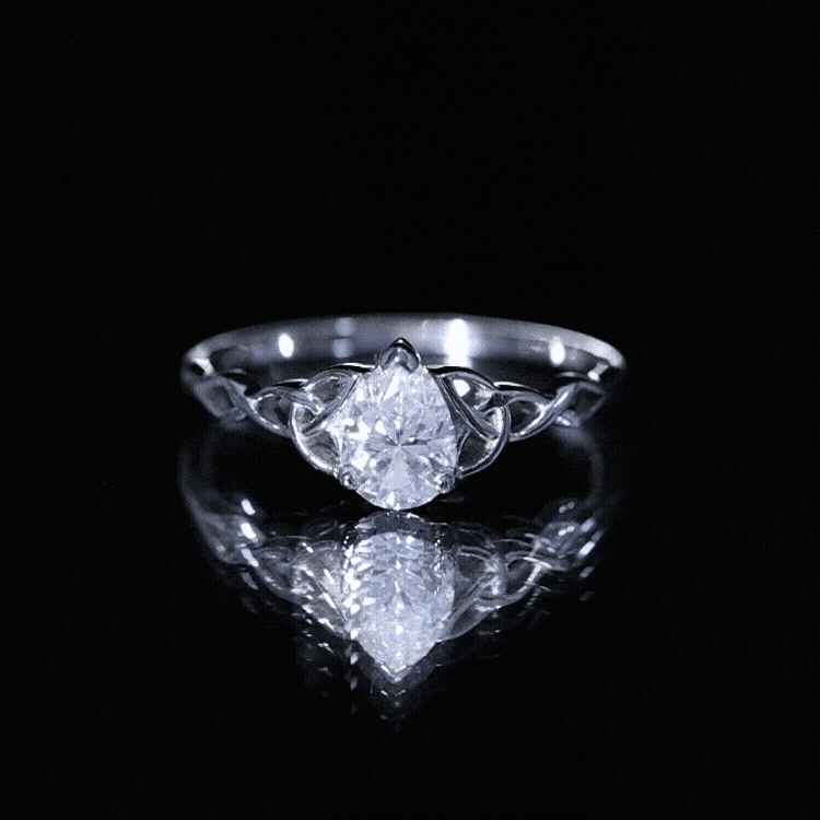 Yellow gold Celtic engagement ring featuring a 0.79 carat pear-shaped moissanite stone by Rosec Jewels