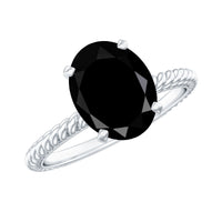 Oval cut black onyx solitaire engagement ring with diamond accent, crafted by Rosec Jewels, showcasing elegant jewelry design.