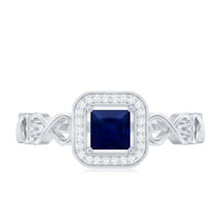 Rosec Jewels natural princess cut blue sapphire diamond promise ring with infinity heart shank, showcasing detailed craftsmanship and elegant design.