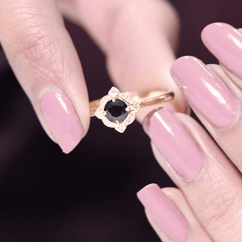 Vintage black spinel and diamond engagement ring by Rosec Jewels featuring intricate design and sparkling gemstones.