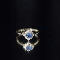 Vintage style 0.9 carat blue sapphire engagement ring with diamond halo by Rosec Jewels, featuring a silver band and intricate design.