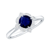 Vintage style 0.9 carat blue sapphire engagement ring with diamond halo, featuring intricate design and sparkling accents.