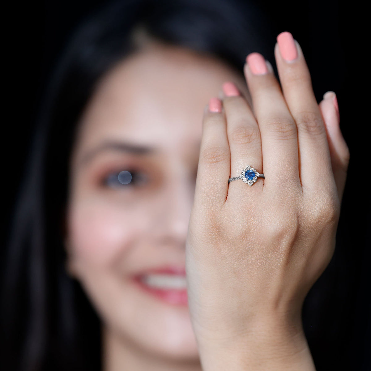 Vintage style 0.9 carat blue sapphire engagement ring with diamond halo by Rosec Jewels, showcasing intricate design and sparkling gemstones.