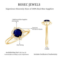 Vintage style 0.9 carat blue sapphire engagement ring with diamond halo by Rosec Jewels, featuring intricate metalwork and sparkling stones.