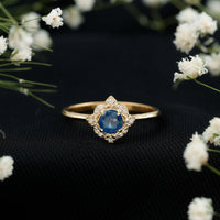 Vintage style 0.9 carat blue sapphire engagement ring with diamond halo by Rosec Jewels, showcasing intricate design and sparkling gemstones.