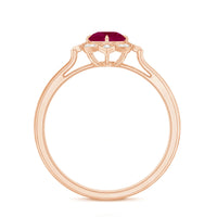 Vintage style 0.6 carat ruby engagement ring with diamond halo from Rosec Jewels, showcasing the detailed design and sparkling gemstones.
