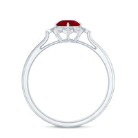 Vintage style 0.6 carat ruby engagement ring with diamond halo from Rosec Jewels, featuring intricate metalwork and sparkling stones.