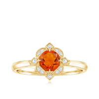 Vintage 1/2 CT fire opal and diamond engagement ring by Rosec Jewels featuring intricate metalwork and sparkling gemstones.