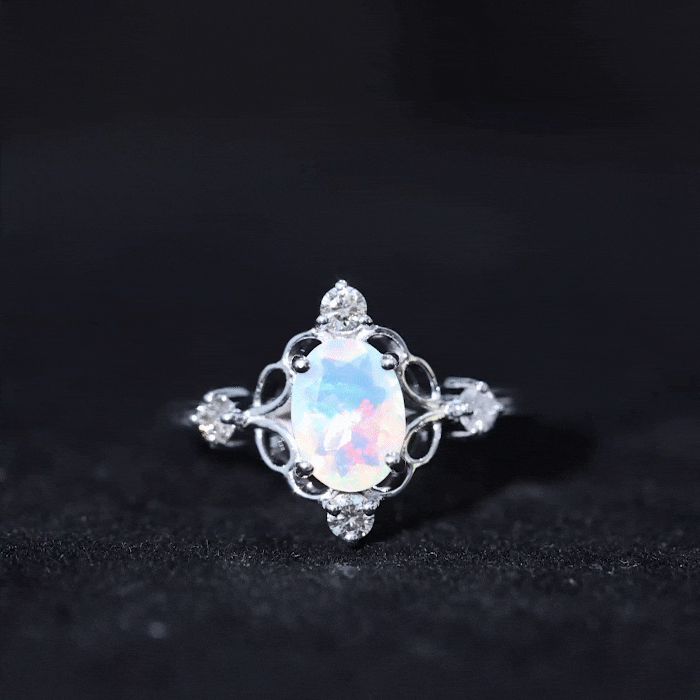 Ethiopian Opal and diamond engagement ring by Rosec Jewels featuring a yellow gold band and intricate gemstone setting.