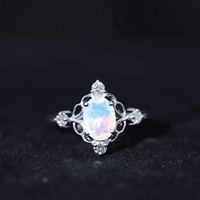 Ethiopian Opal and diamond engagement ring by Rosec Jewels featuring a yellow gold band and intricate gemstone setting.