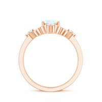 Ethiopian Opal and diamond engagement ring by Rosec Jewels featuring a central opal gemstone surrounded by diamonds in a sleek ring setting.