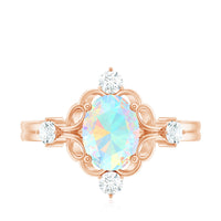 Ethiopian Opal and diamond engagement ring by Rosec Jewels featuring a central opal gemstone with diamond accents on a silver band