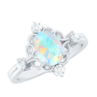 Ethiopian Opal and diamond engagement ring by Rosec Jewels featuring a central opal gemstone and sparkling diamond accents.