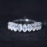 Oval cut moonstone half eternity wedding band ring by Rosec Jewels with alternating moonstone and metal setting.