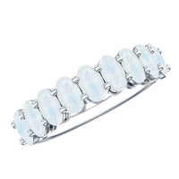 Oval cut moonstone half eternity wedding band ring by Rosec Jewels with polished metal setting and alternating moonstone stones.