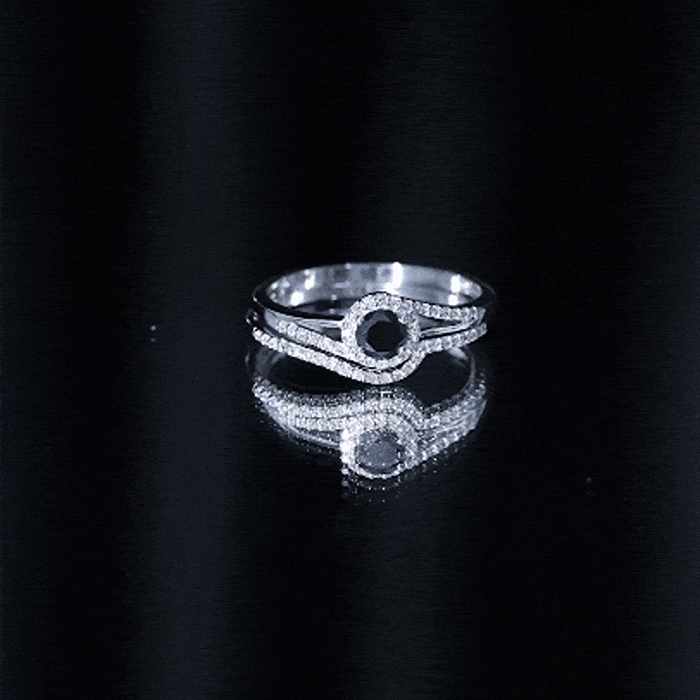 Black Onyx and diamond curved wedding rings set by Rosec Jewels, featuring sleek black onyx and sparkling diamonds in a minimalist design.