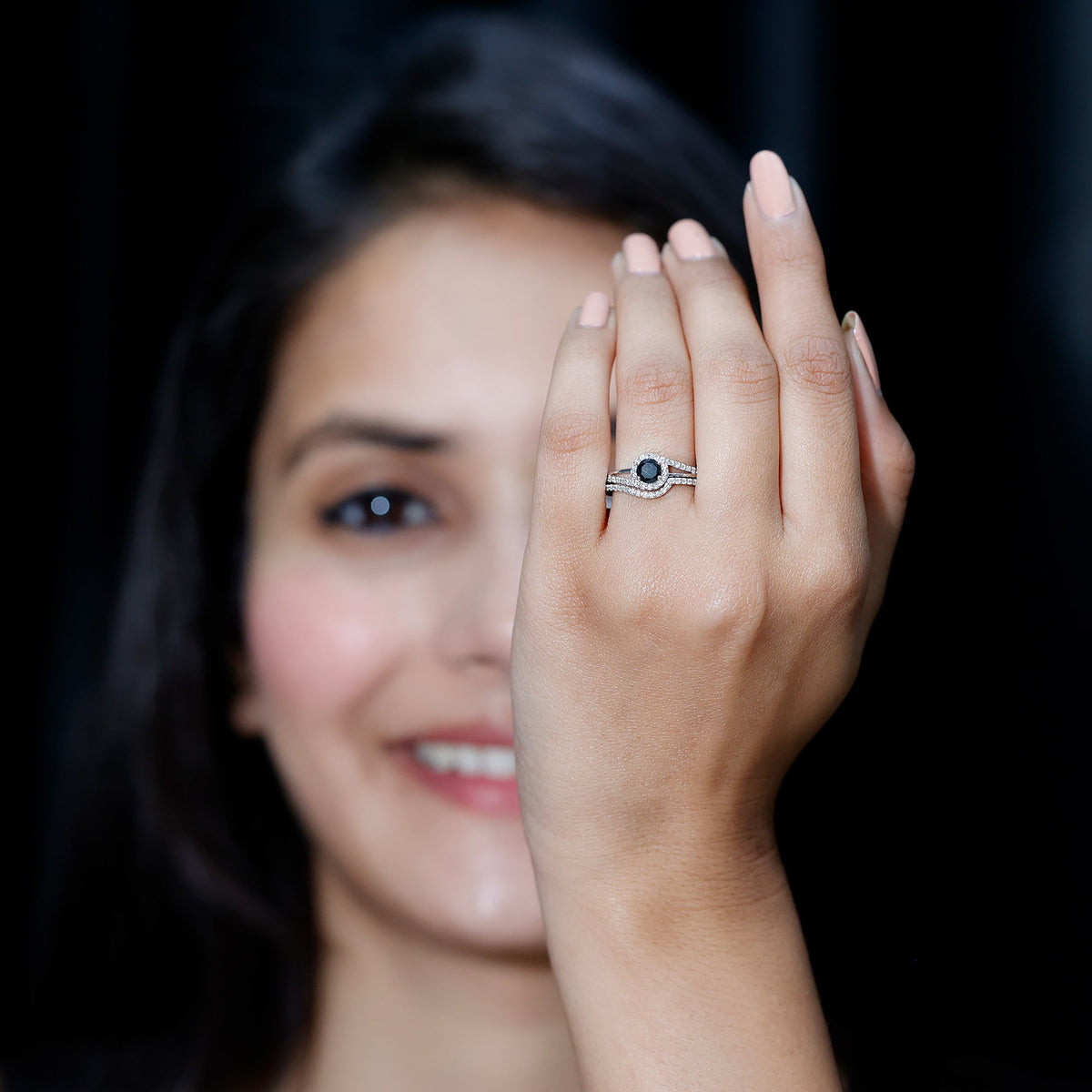 Black Onyx and diamond curved wedding rings set by Rosec Jewels, featuring sleek black onyx stones and elegant diamond accents.