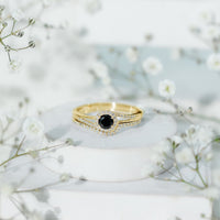 Black Onyx and diamond curved wedding rings set by Rosec Jewels, featuring minimalist design and polished band details.